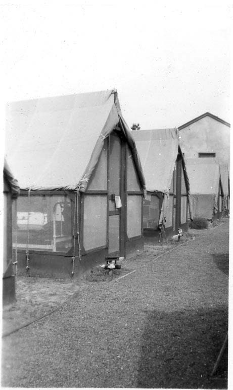 three tents stand in a line
