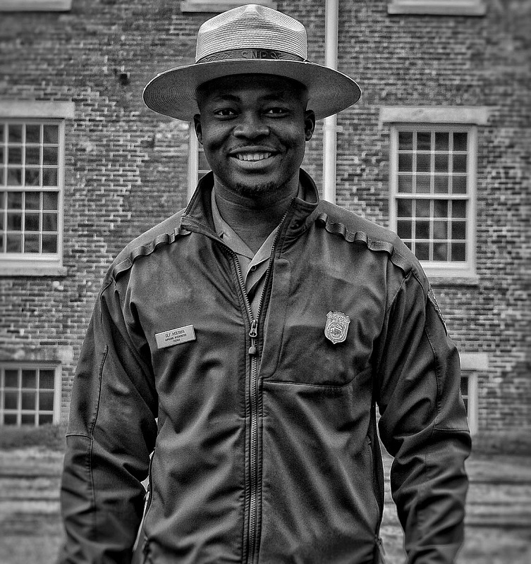 Olf Mouyaka Smiling black and white picture of Olf smiling on his park ranger outfit
