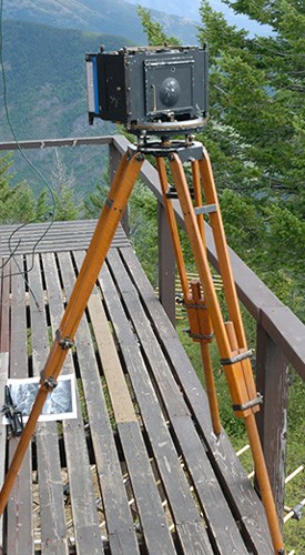 Osborne's camera Camera mounted on a tripod set up on a deck
