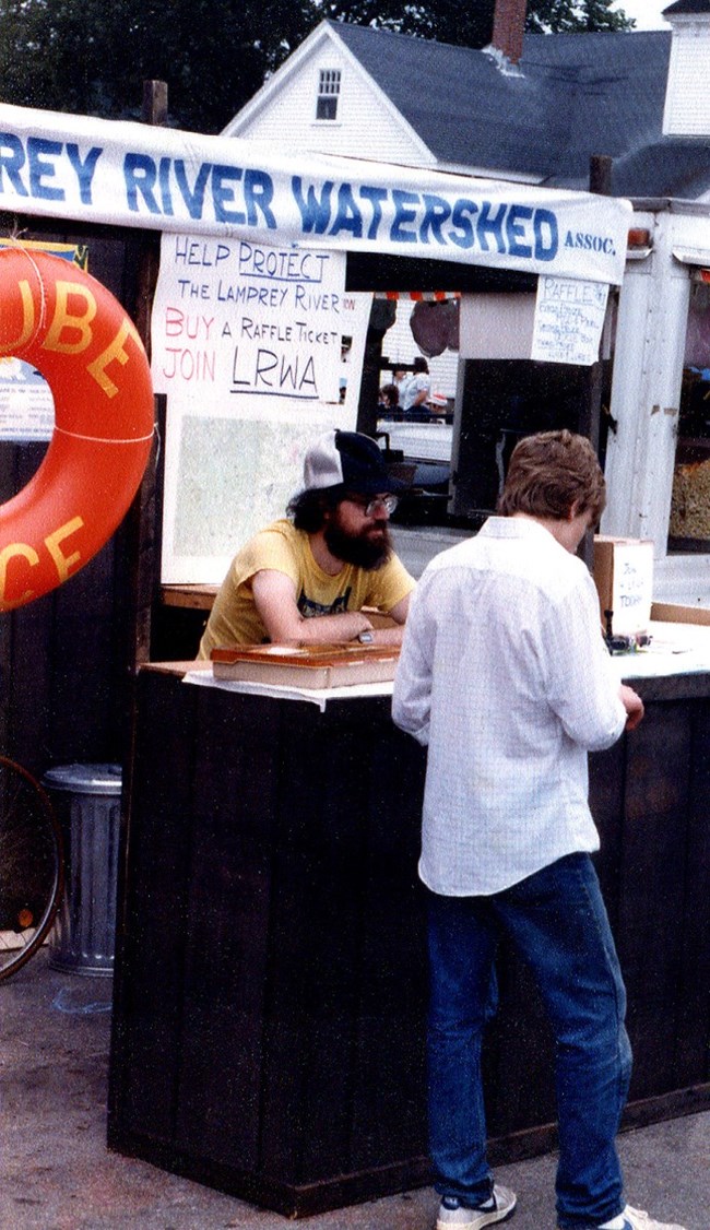 Dick Lord at LRWA booth promoting tube races.  Photo provided by LRWA.