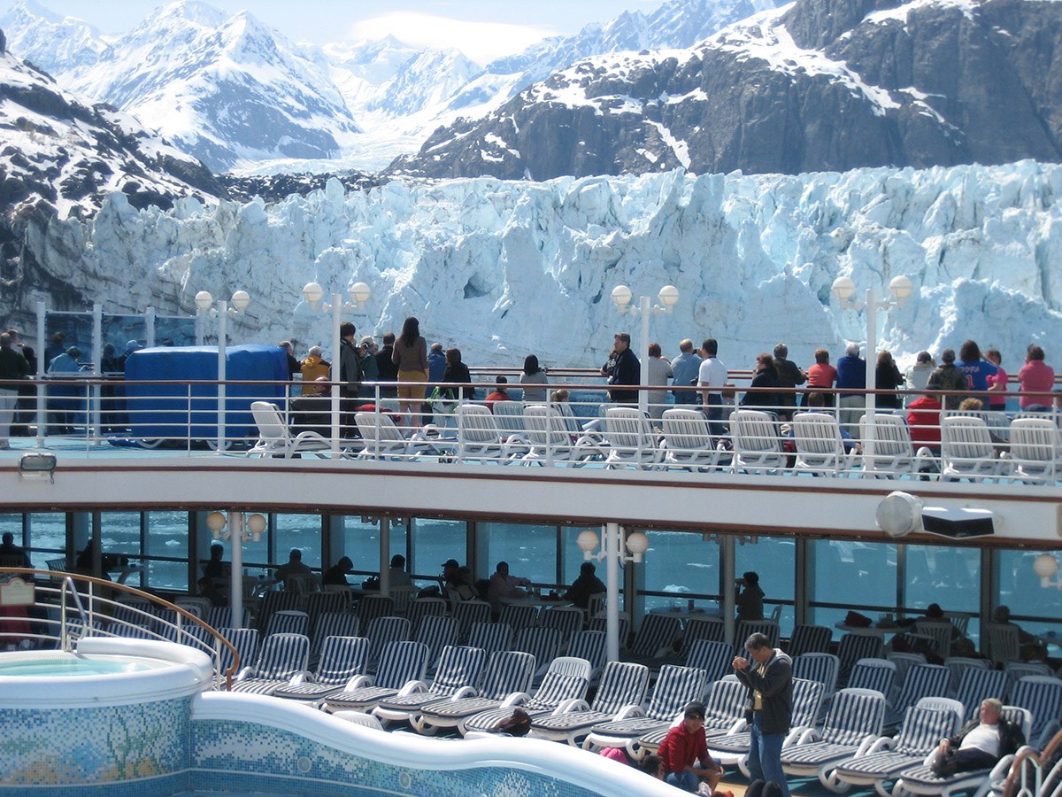passengers marjorie glacier_NPS_web Passengers on a cruise ship line up at the railing to see a glacier up close.