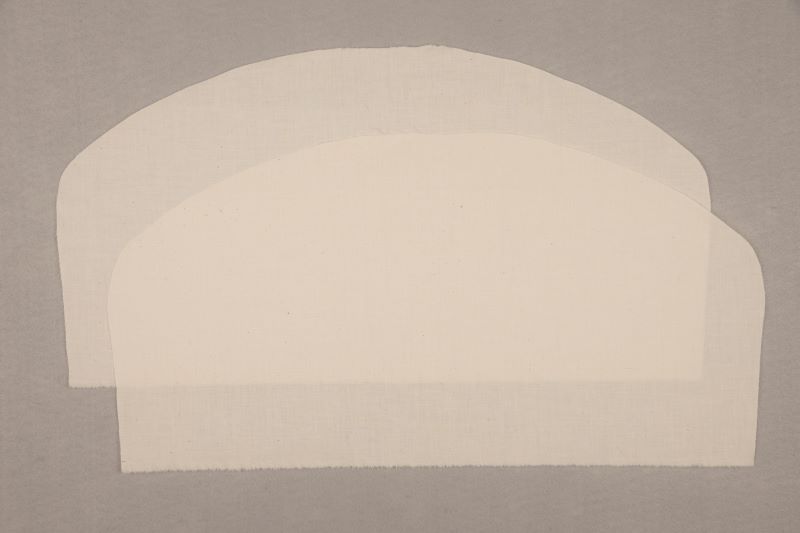 Two pieces of muslin cut using a pattern