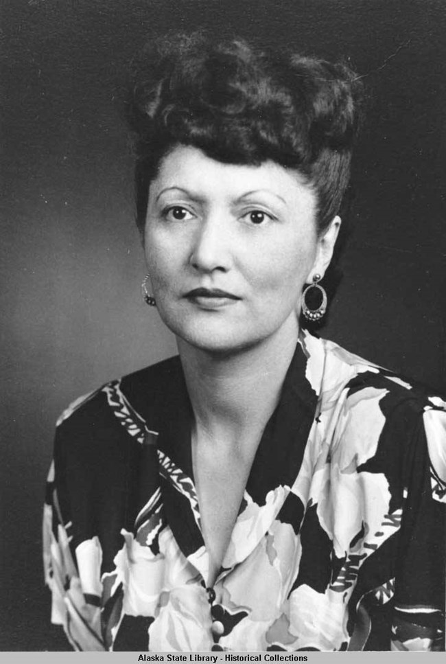 peratrovich 1 portrait style photo of a woman dressed in a floral print dress