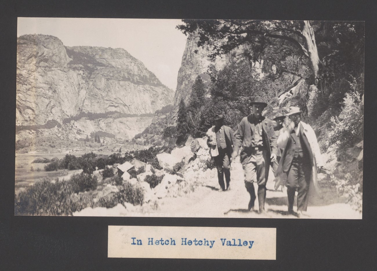 In Hetch Hetchy Valley Men walking on a dirt road in the Hetch Hetchy Valley