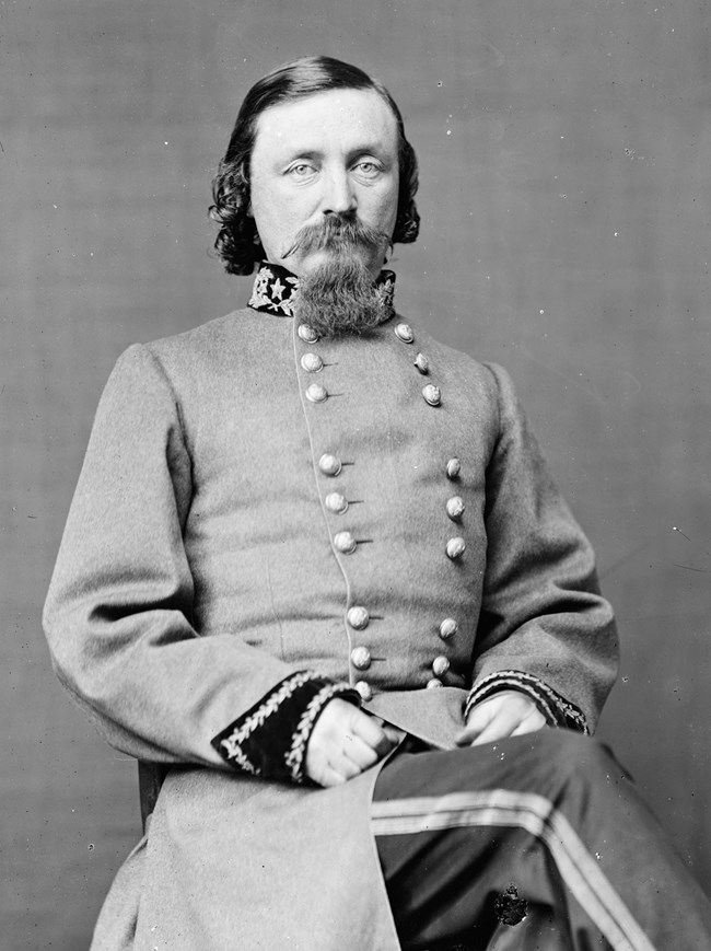Black and white historical photo of seated Confederate General.