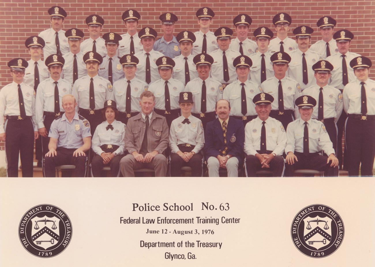 Four rows of US Park Police officers, most in uniform, pose for a class photo.