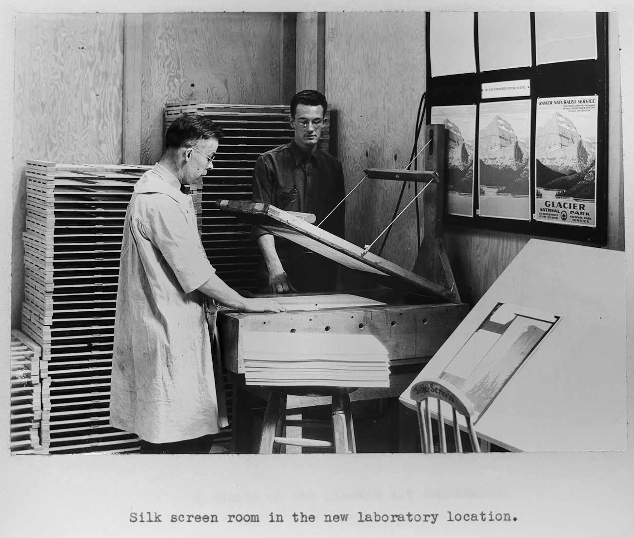 C. Don Powell and Dale Miller Don Powell demonstrates silkscreen printing to Dale Miller