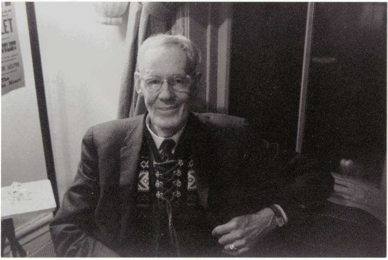 prescott 1960s Prescott Townsend sitting in a chair smiling.