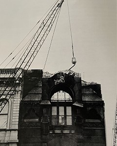Provident Life and Trust building Tall building being torn down with a crane and wrecking ball in the background.