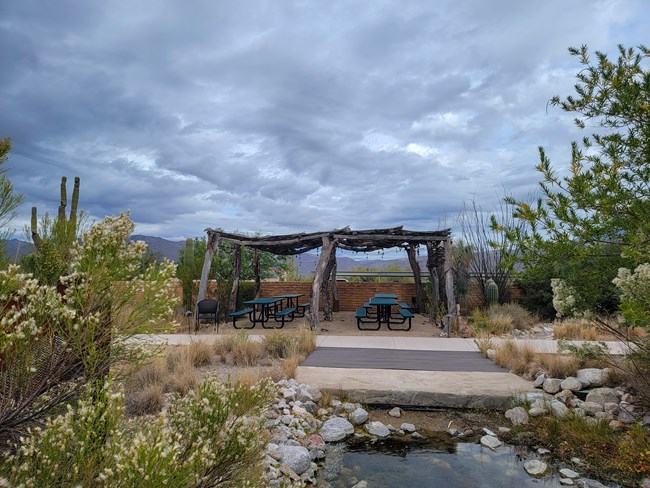 Ramada A ramada over picnic tables during a cloudy day.