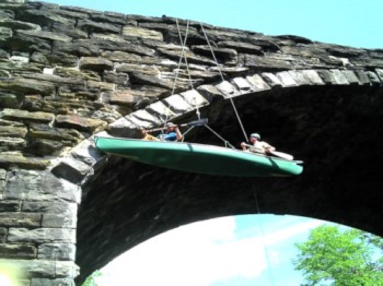 Volunteers used canoes to work on maintenance and repair the Keystone Arches. Photo credit: Keystone Arches website.