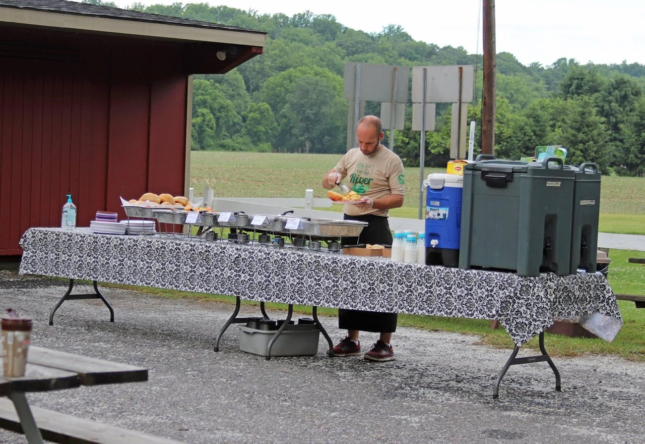 During the Sojourn, participants enjoy meals together, camp, and listen to educational lectures when off the river. Photo courtesy of Delaware River Sojourn social media.