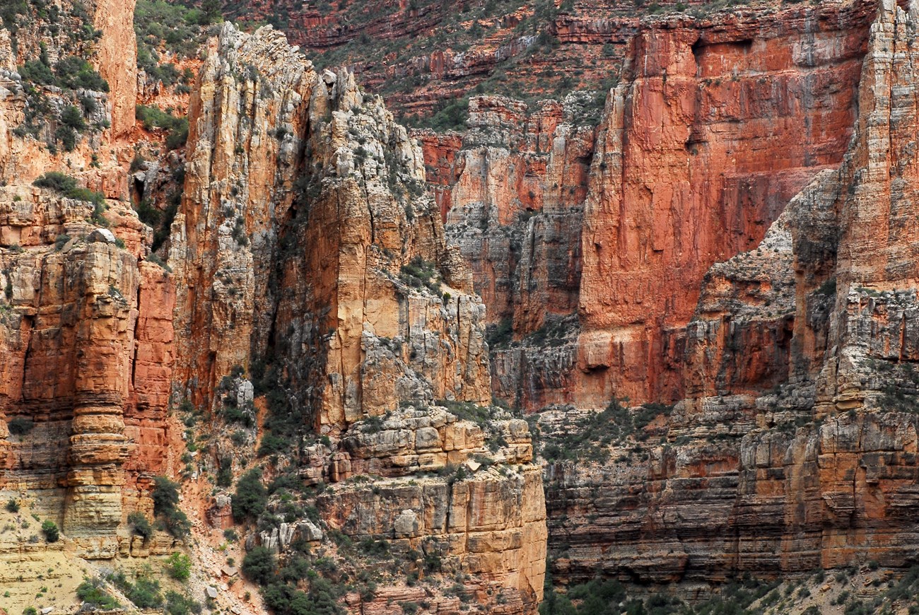 Photo of layered red rock cliffs.
