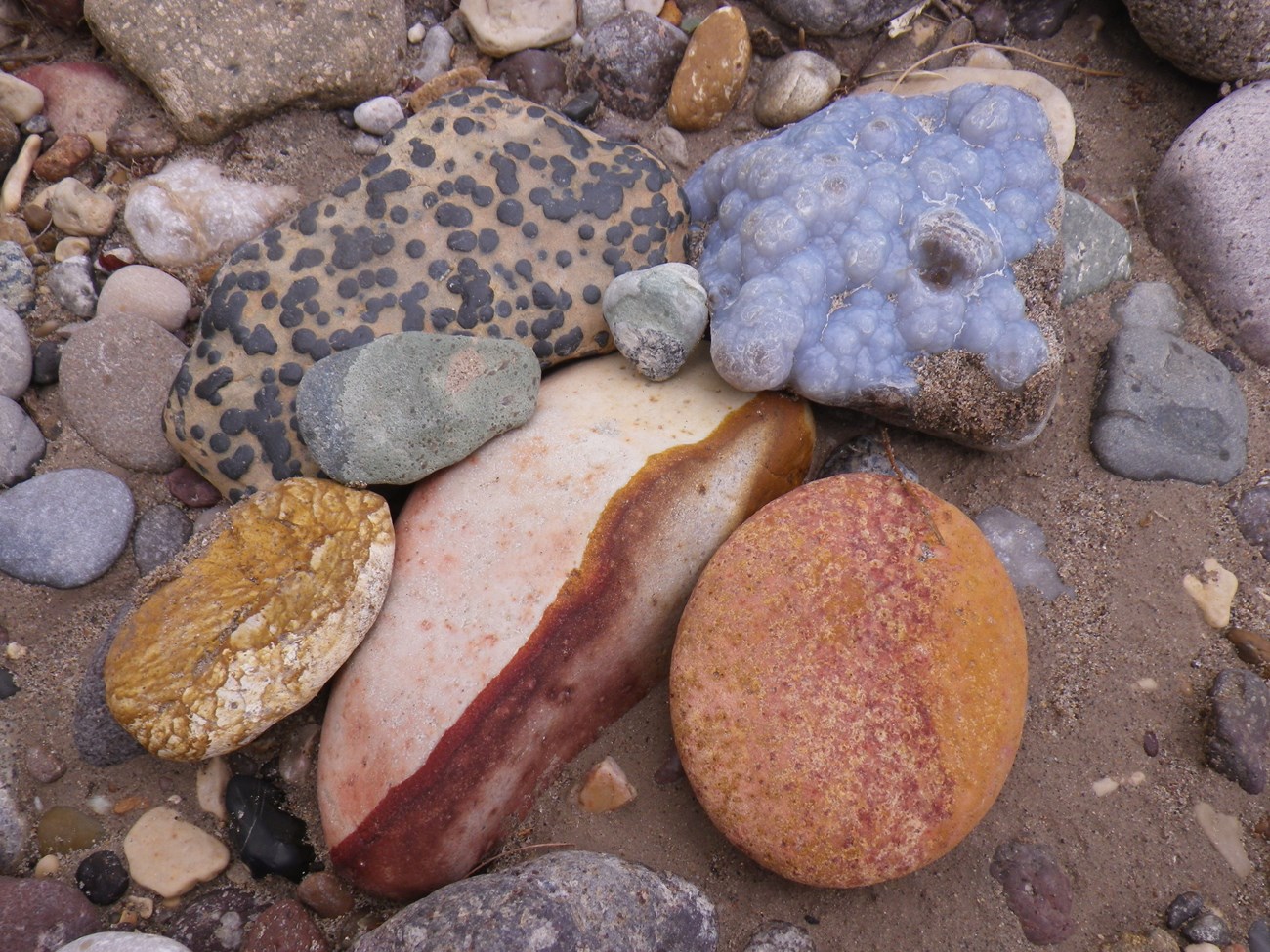 intricately patterned and colored river rocks