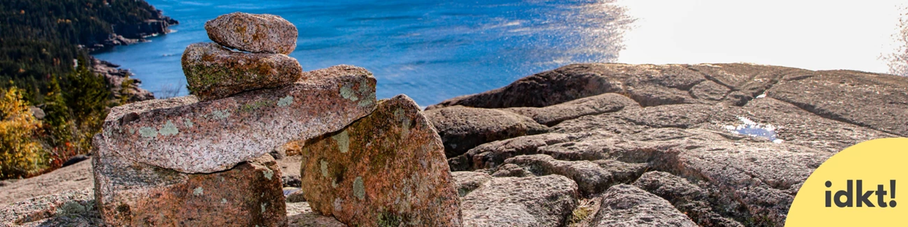 Rock Cairns a rock cairn on the edge of a cliff over the ocean