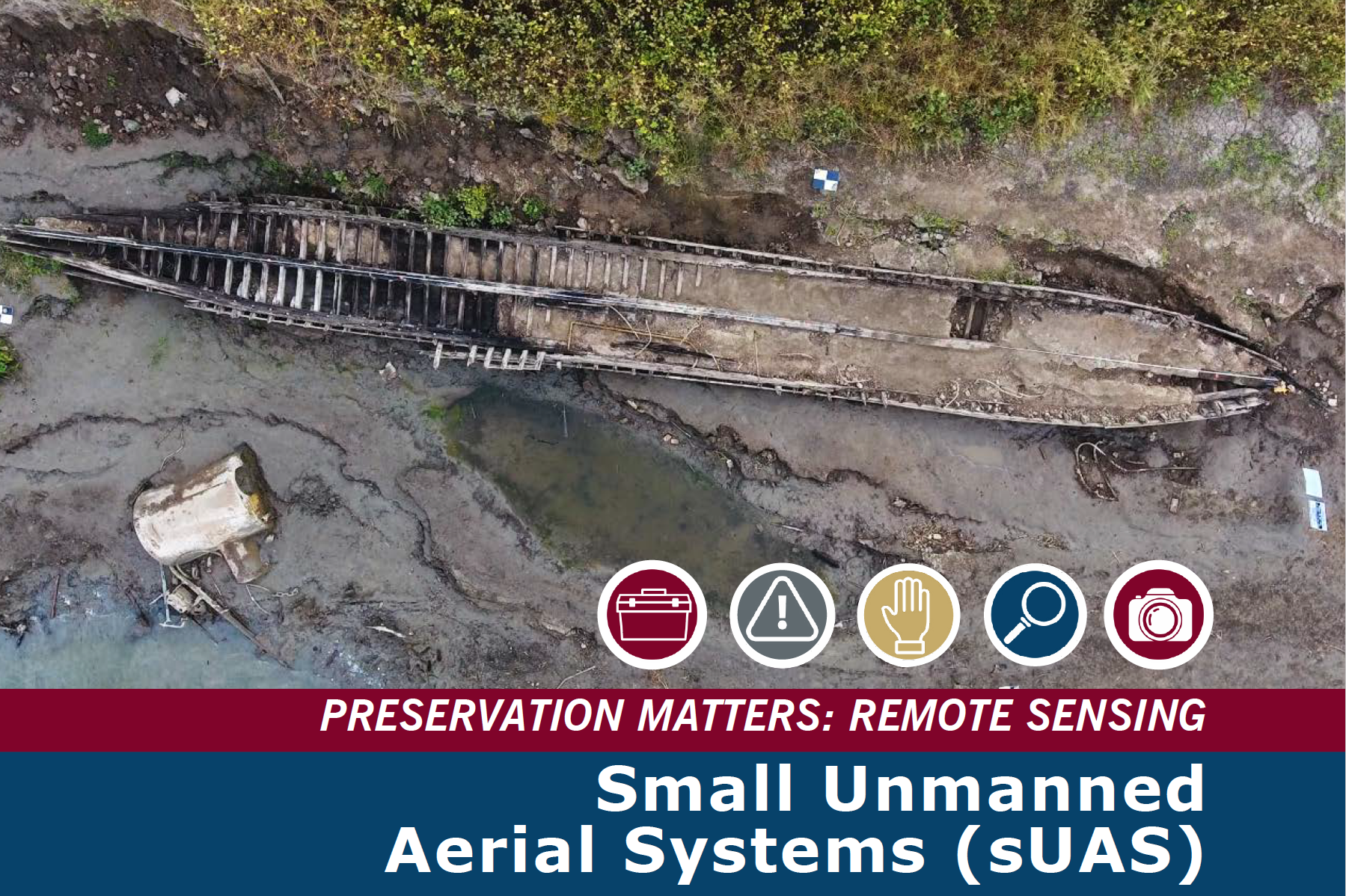 An overhead view of the remains of a boat on a shore.