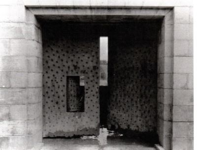 Large wooden doors slightly open