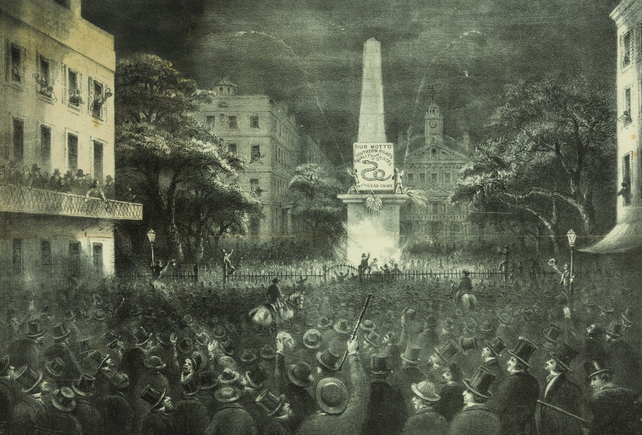 People gathered around monument celebrating
