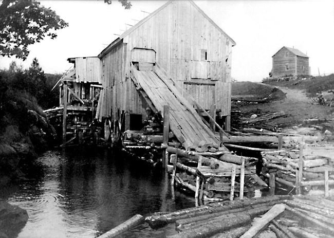 sawmill B&W photo of sawmill above water