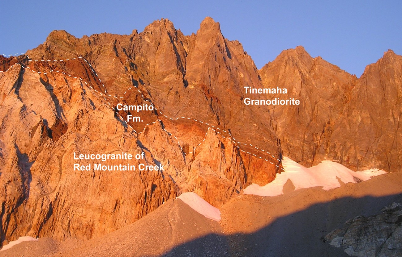 mountain cliff face with geologic contacts shown