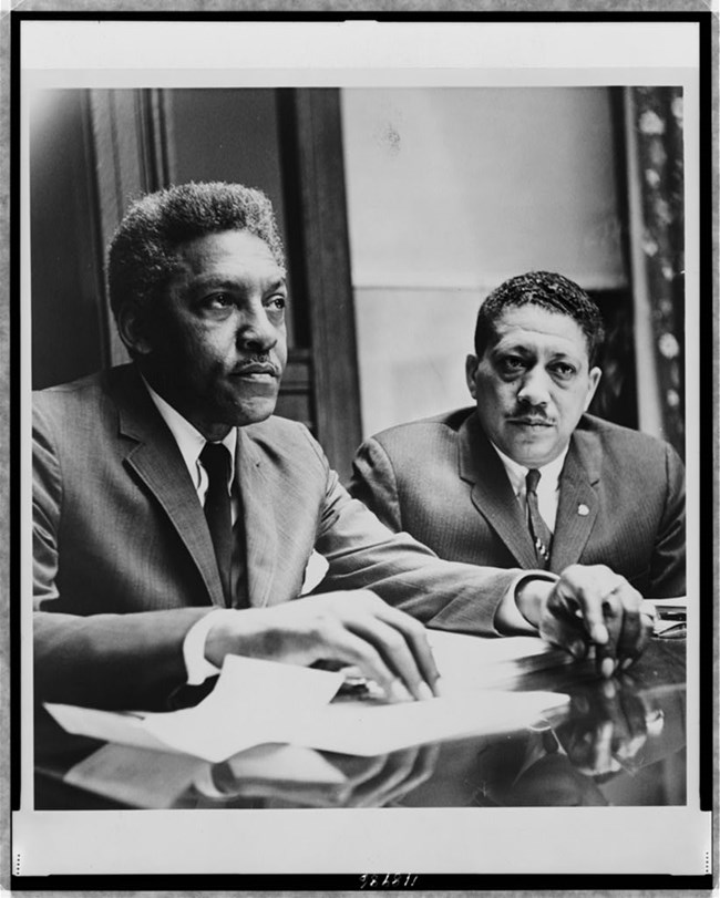 Two men sitting at a table.