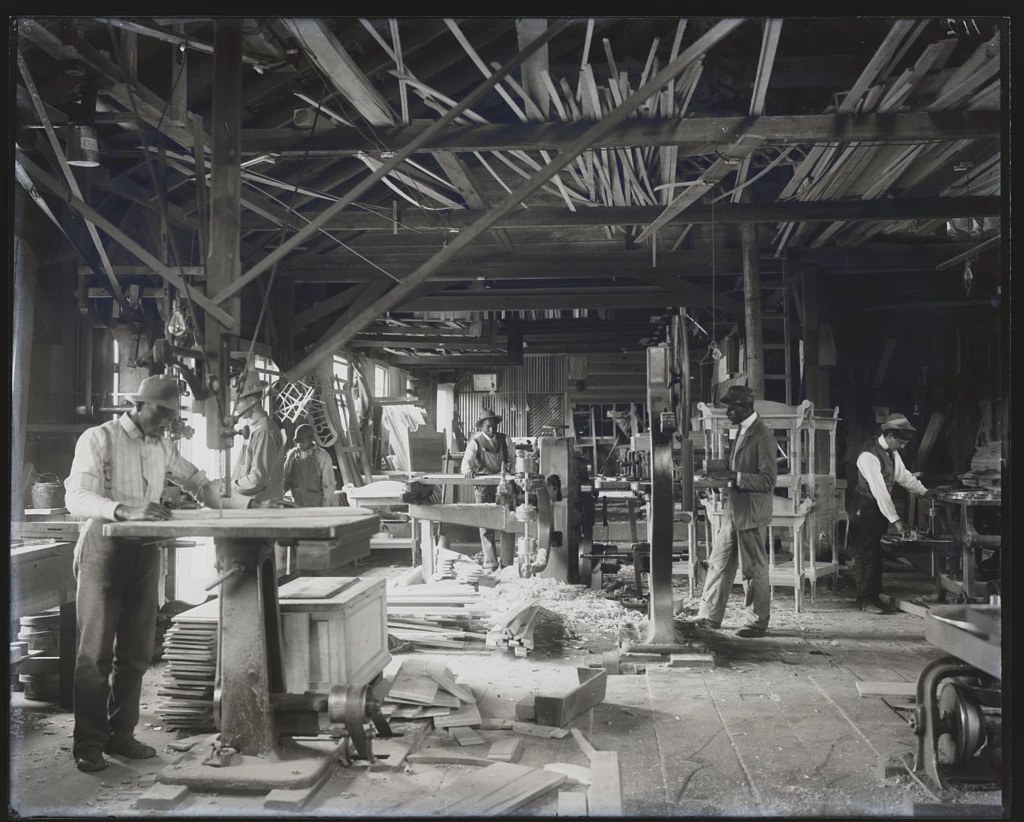 Tuskegee Institute students in a wood workshop, circa 1902. Tuskegee Institute students in a wood workshop, circa 1902.