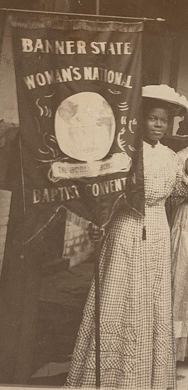 Burroughs holding banner.