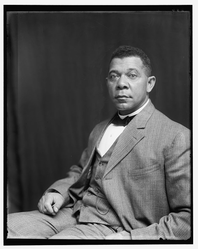 Booker T. Washington, half-length portrait, seated