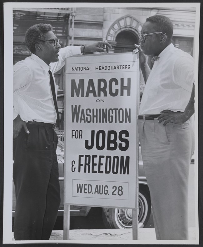 Two men holding sign promoting March on Washington. Two men holding sign promoting March on Washington