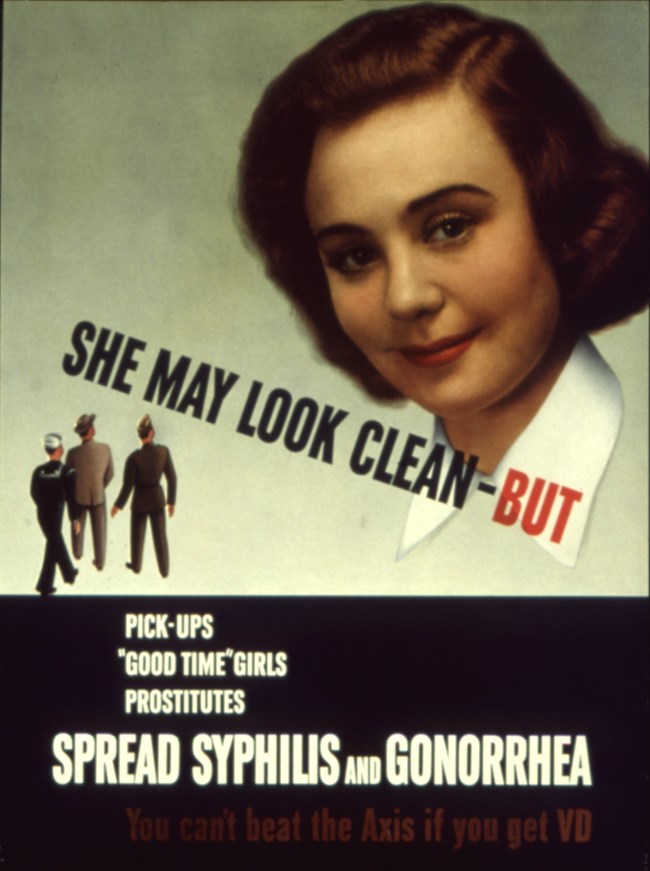 She May Look Clean, But... Large face of brunette woman with small male figures in the low left corner and the words "She May Look Clean-But"