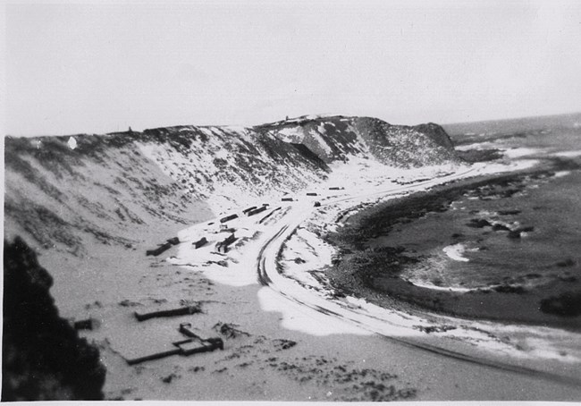 black and white photo of snowy coast