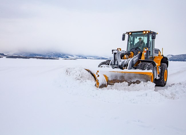 Snowplow Snowplow works to plow snow from roadway.