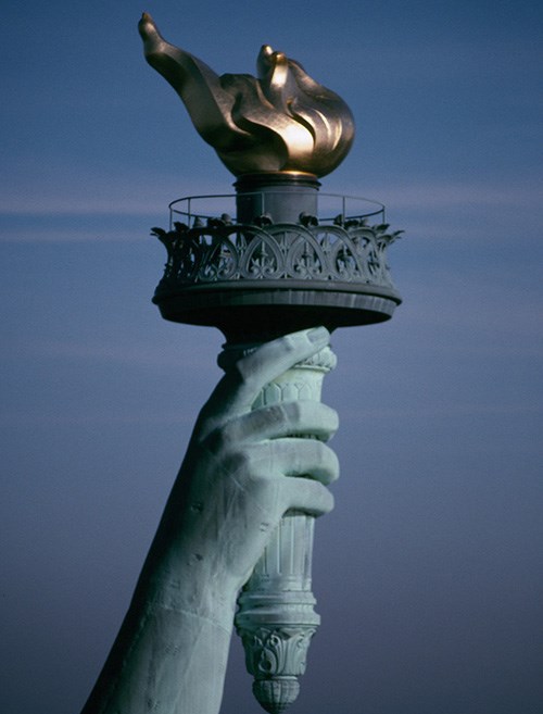 Close up of the Statue of Liberty's arm and  torch.