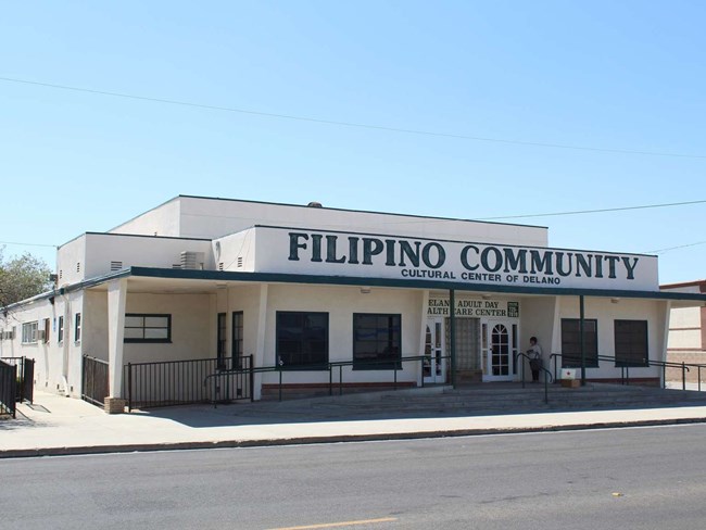 The Delano, California, Filipino Community Hall Exterior of white building with green painted lettering