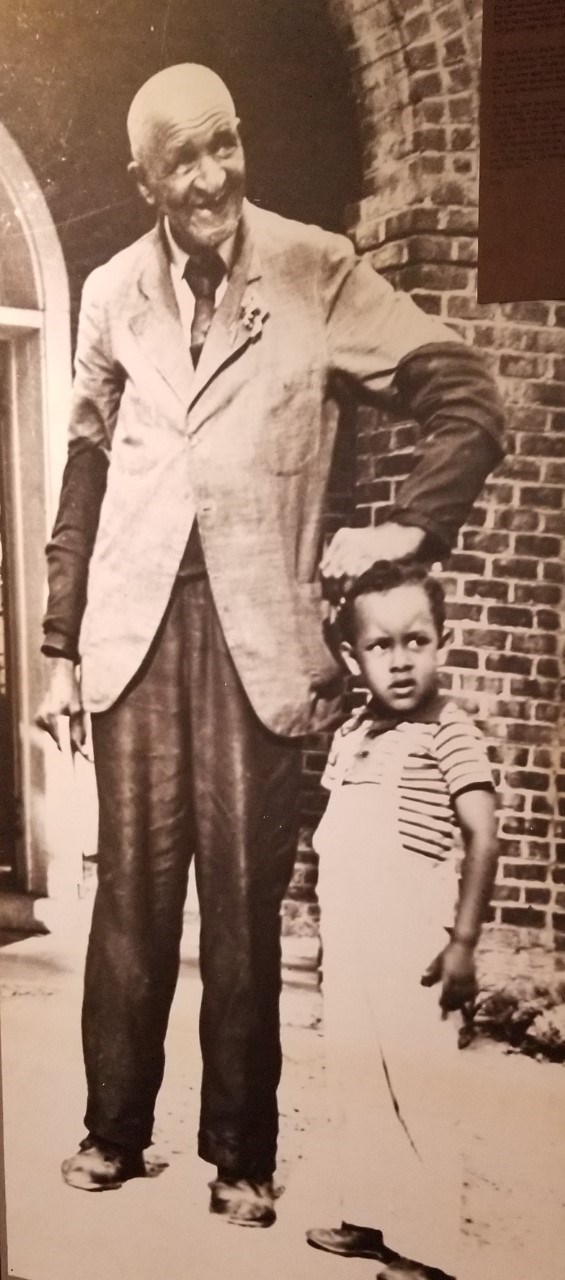 Antique photo of older man and child