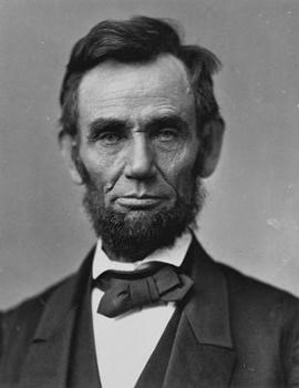 Bust photo of Abraham Lincoln. He is facing the camera and wearing mid-1800s attire.