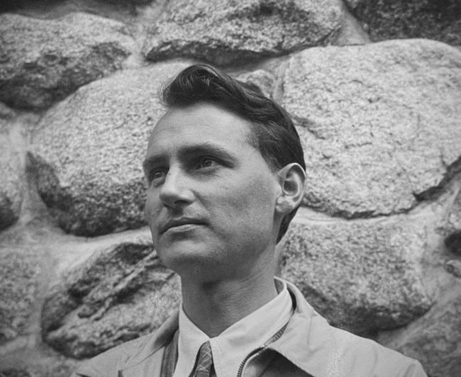 Walter G. Rivers Walter Rivers standing in front of a stone wall