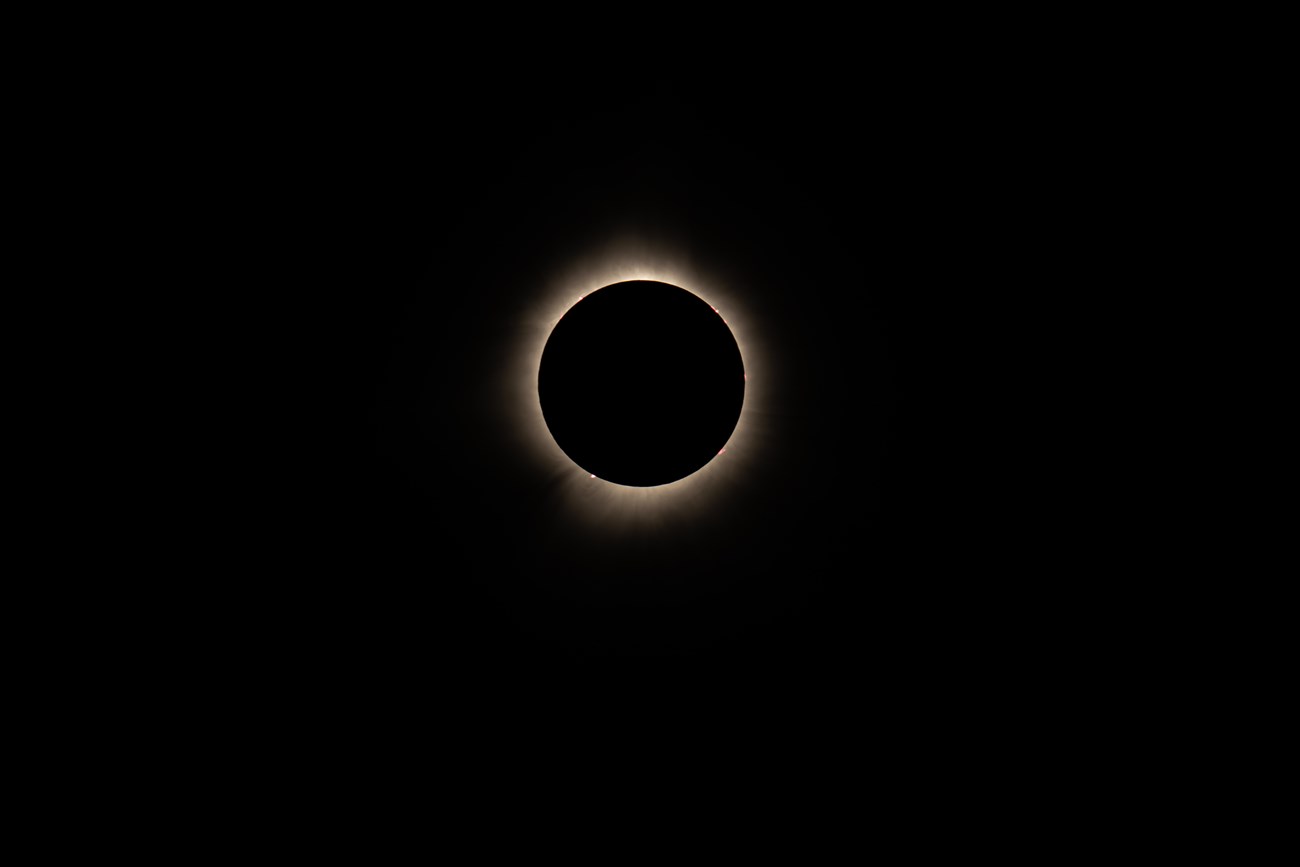 total eclipse a total solar eclipse where just a small outline of the sun is visible behind the moon