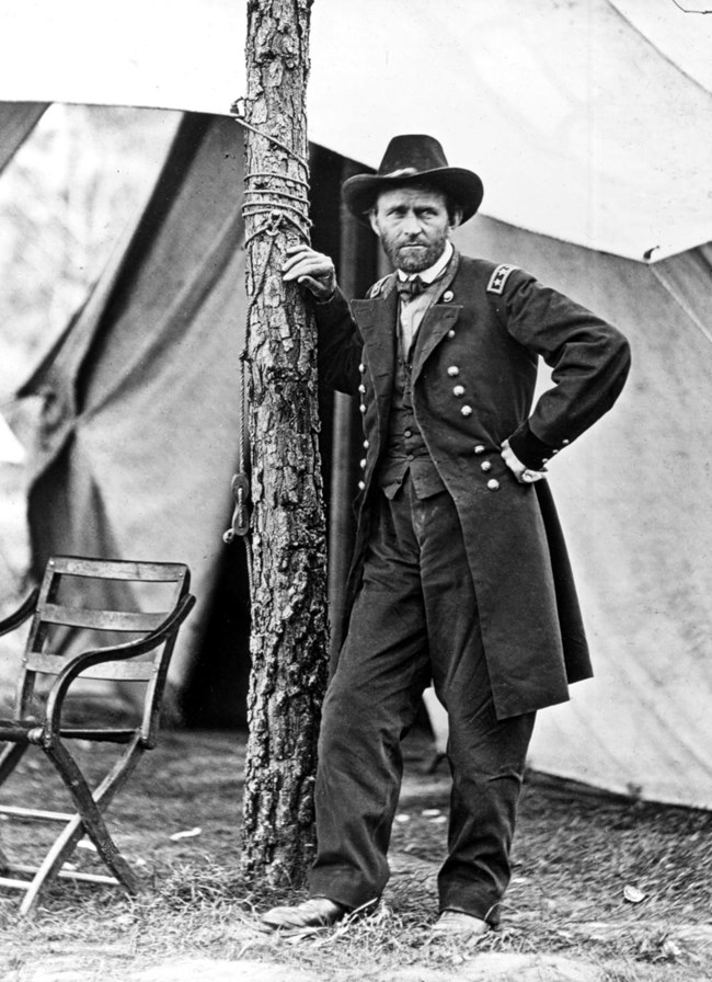 Union general Ulysses S. Grant, leaning on a tree.