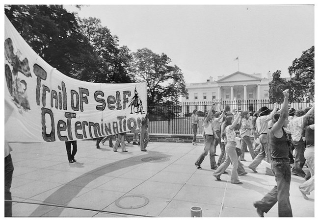 Protesters march in front of White House