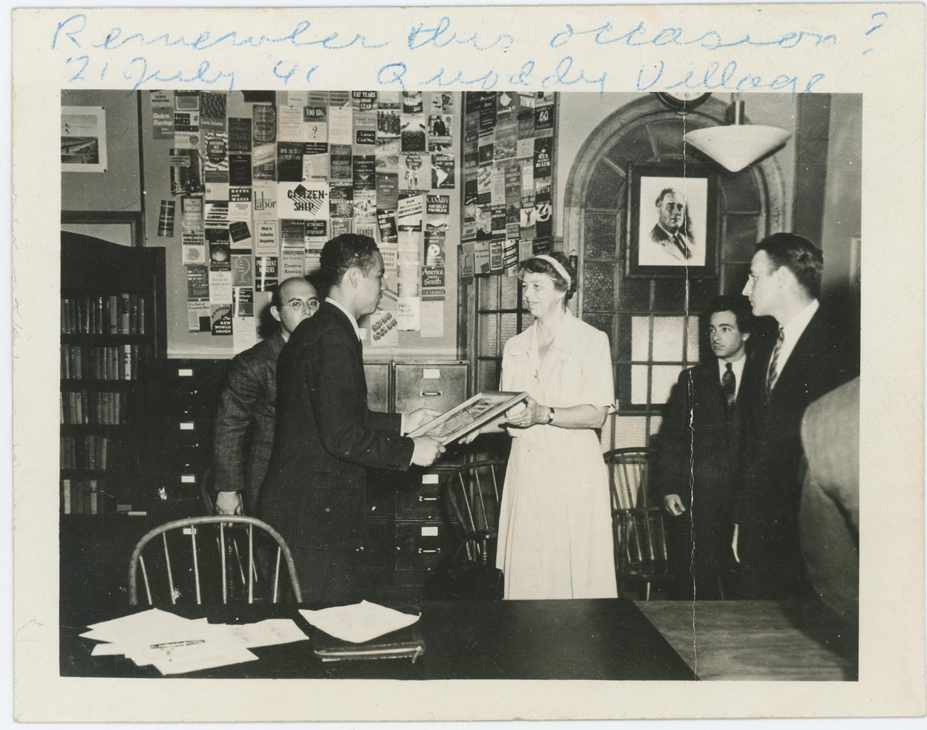 Cecil Peterson and Eleanor Roosevelt’s first meeting. Eleanor is handing Cecil a picture frame.
