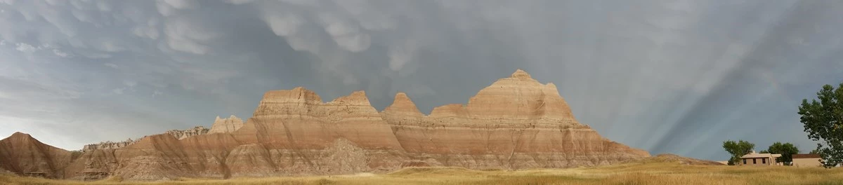 used-22 dark cloud cover over badlands buttes