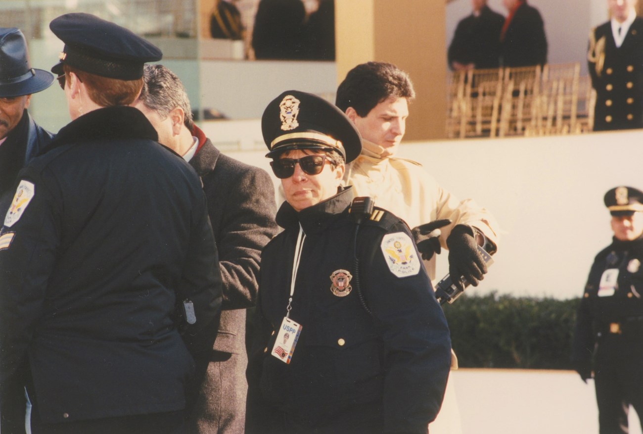 Captain Valerie Fernandes in uniform standing on the street.