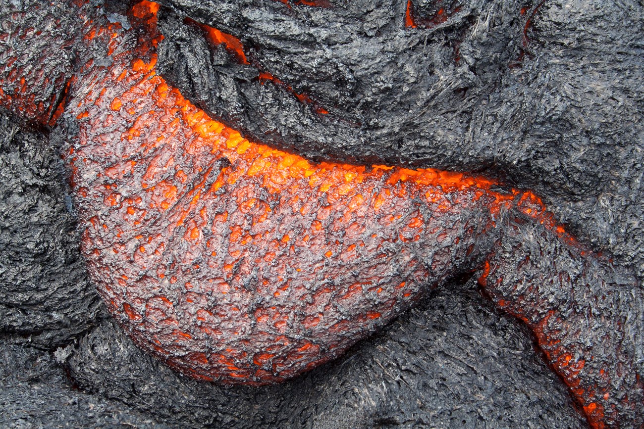 Photo of a lobe of molten lava with a spiny surface.