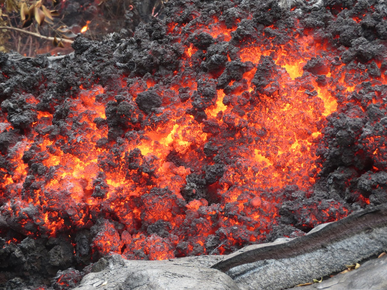 Close up view of ‘a‘ā showing the incandescent interior as well as the cooled rubbly clinker.