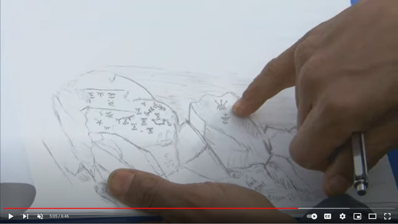 Screen capture from “The Appearing and Disappearing Petroglyphs of Cape Alitak" Screen capture from “The Appearing and Disappearing Petroglyphs of Cape Alitak"