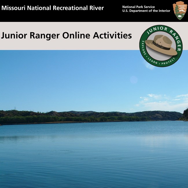 Missouri River water is a blue tint with hills in the background that are a darkish green