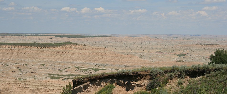 Eastward look at Red Shirt Table Overlook, badlands formations extend out to the horizon.