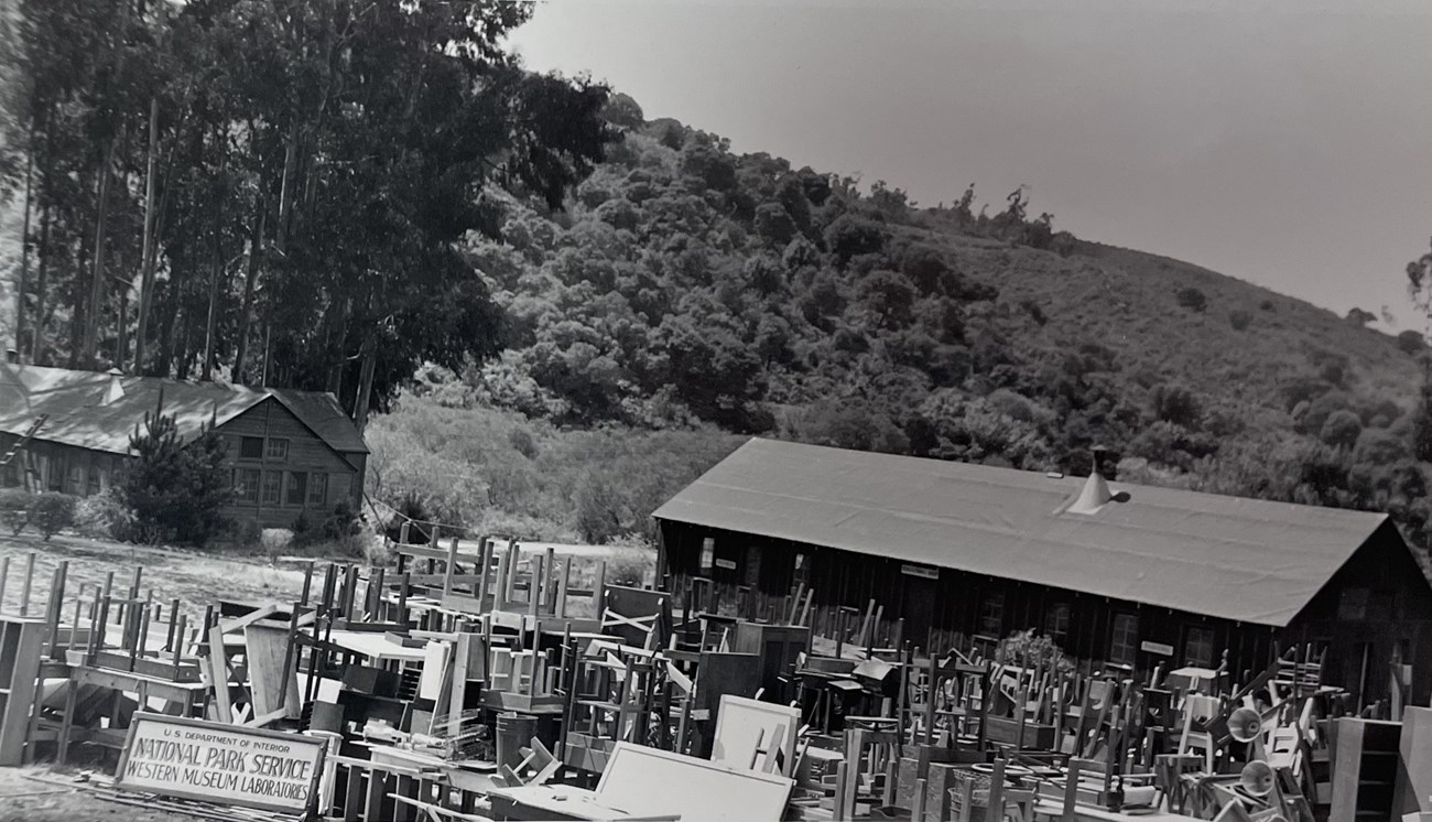 Chairs and other equipment piled up outside a building