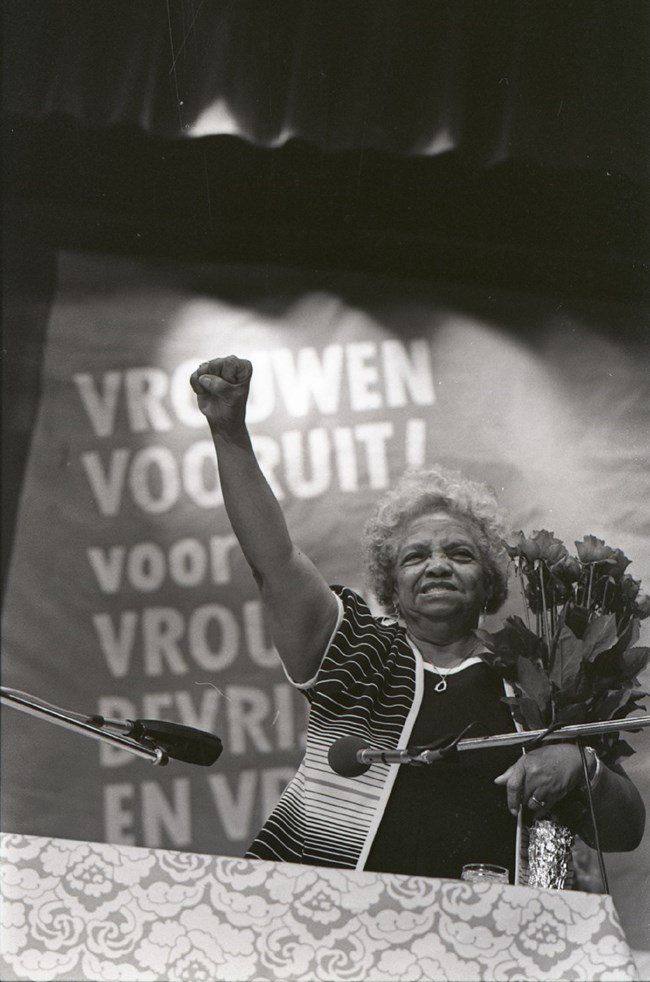 Woman with her arm raised in the air. Woman with her arm raised in the air.